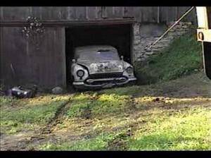 1951 Ford wrecker pulling antique cars out of barn Pt2